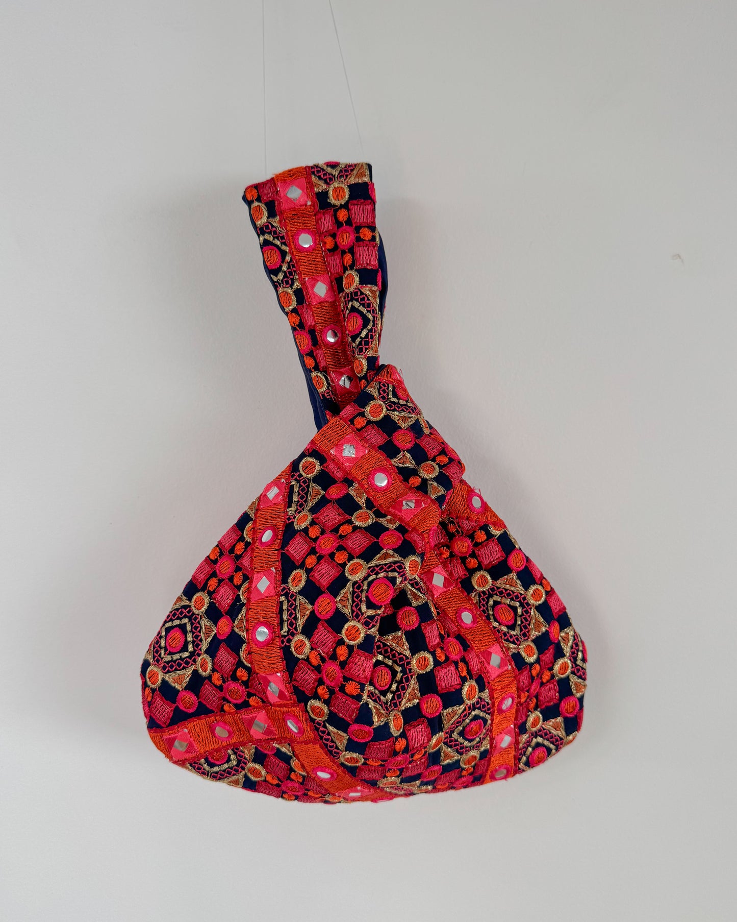 Handmade Embroidered Knot Bag | Blue and orange
